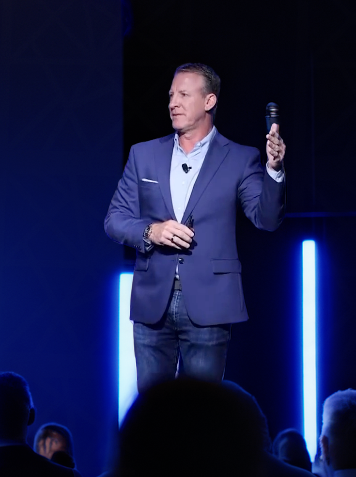 Jeff Bloomfield delivering a keynote on AI and human behavior